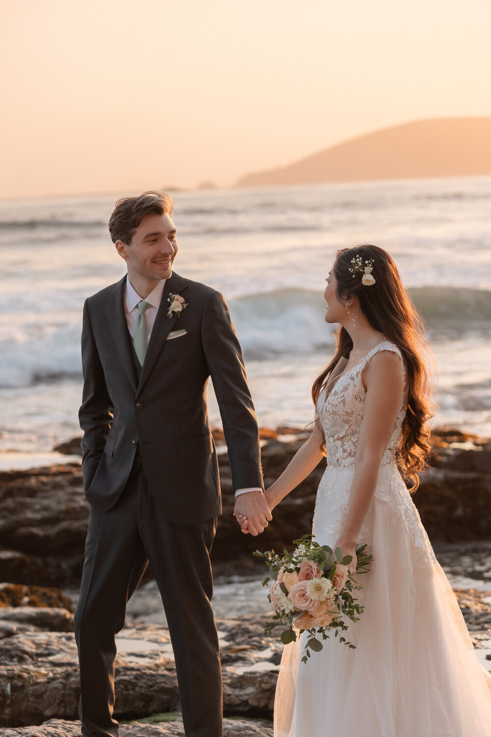 candid romantic Wedding Photos of couple holding hands on beach in Pismo Beach at Dolphin Bay Resort & Spa
