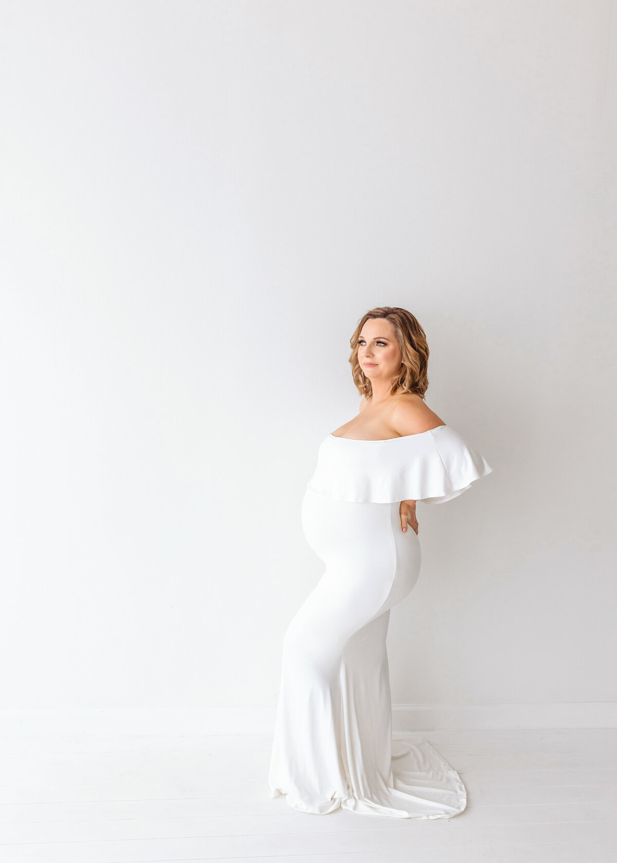 pregnant mom in white gown