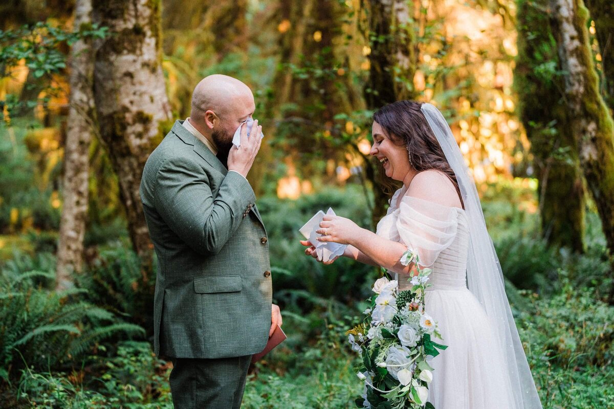 A couple crying during their vows at their Hoh Rainforest Elopement.