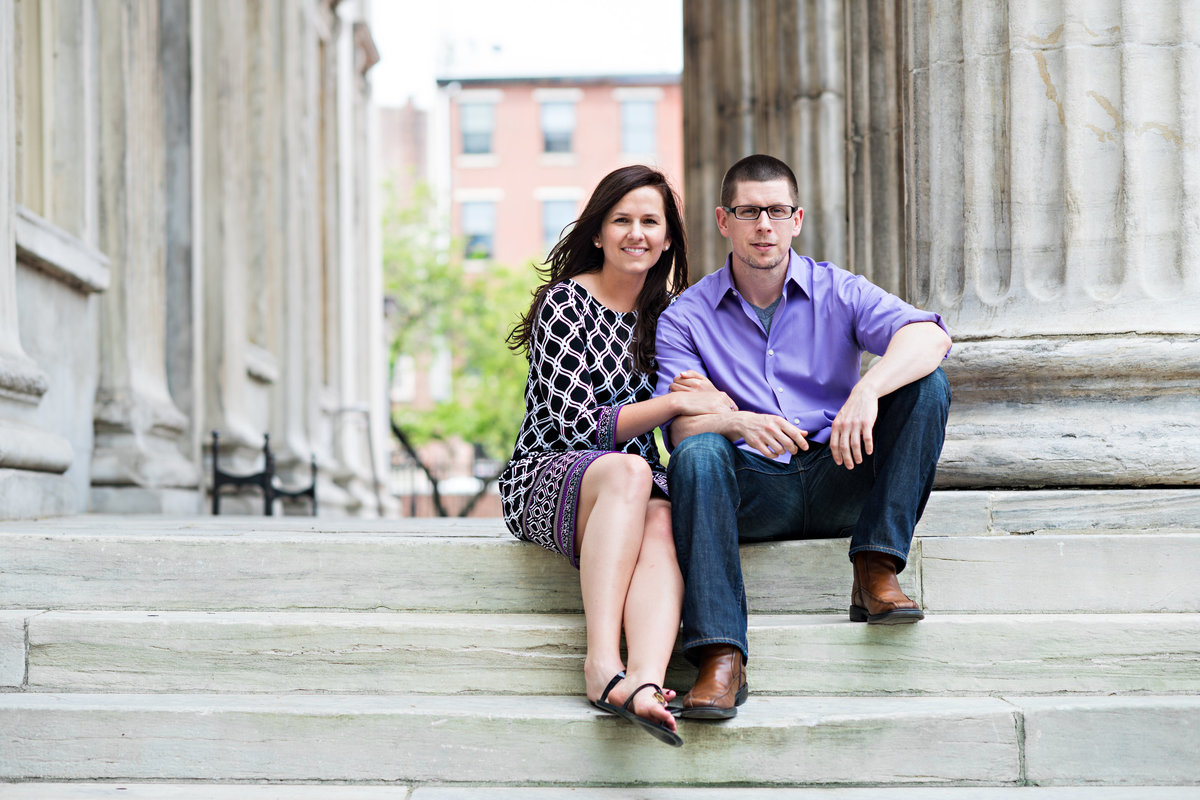 A cute couple on the steps of the first bank in philly.