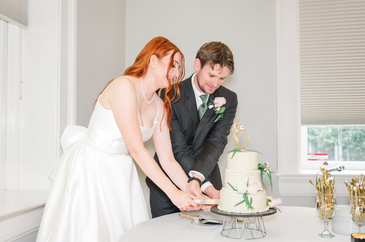 bride and groom enjoying their cake cutting in a luxury lexington wedding venue