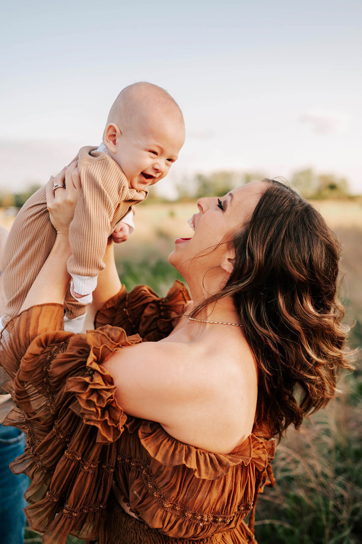 mom and baby smiling in family photo in Springfield MO