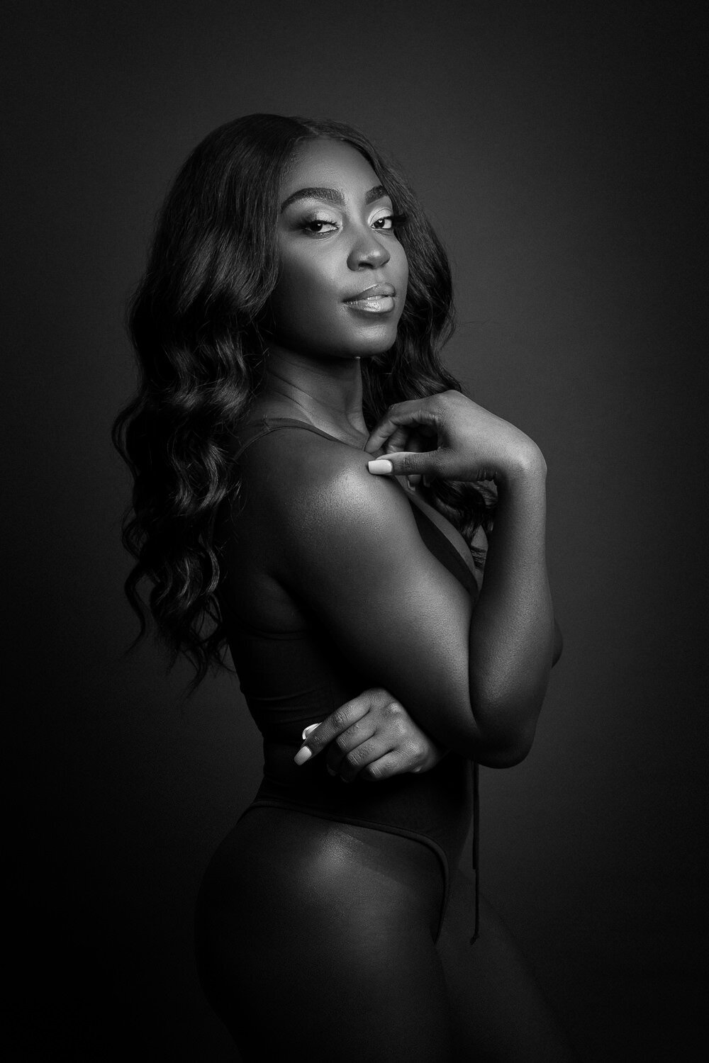 cinematic boudoir portrait with dramatic lighting in Austin