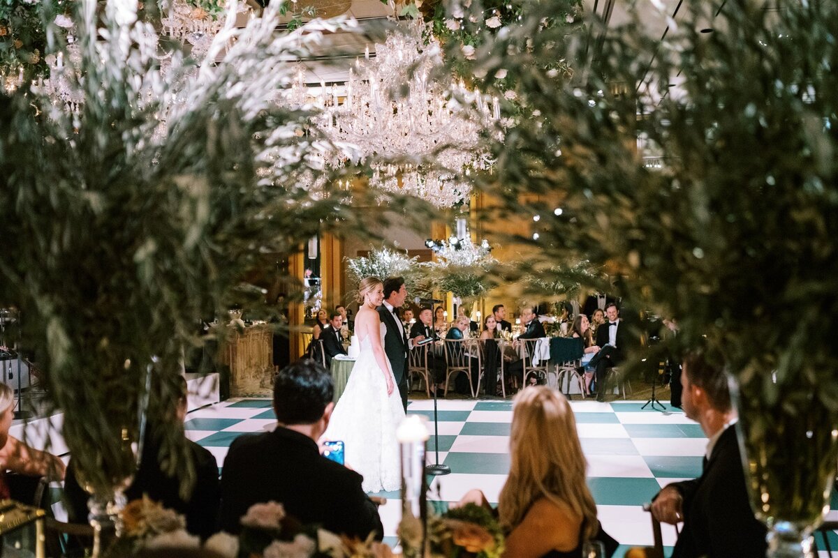 A view of the bride and groom on the dance floor at the wedding reception. 