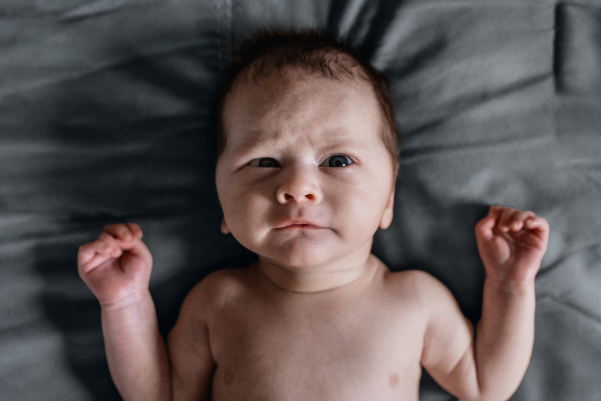 newborn baby looking up by nh newborn photographer