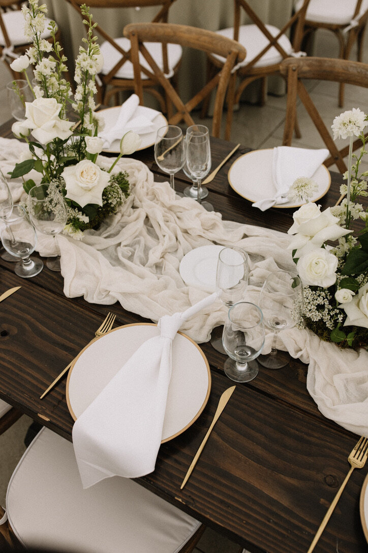 cheese cloth, moss, wood table numbers, white roses, bella donna, gold flatware, farm tables