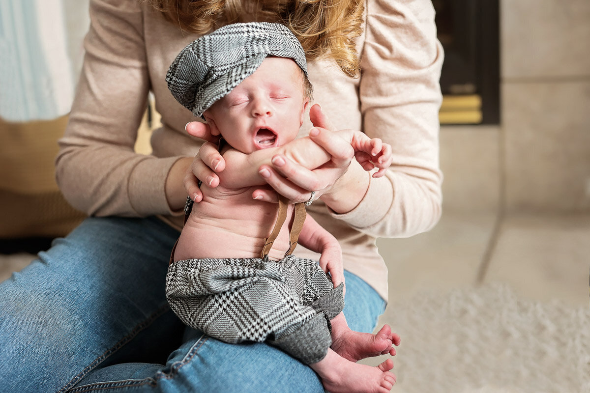 Newborn in mama hands at home in Calgary