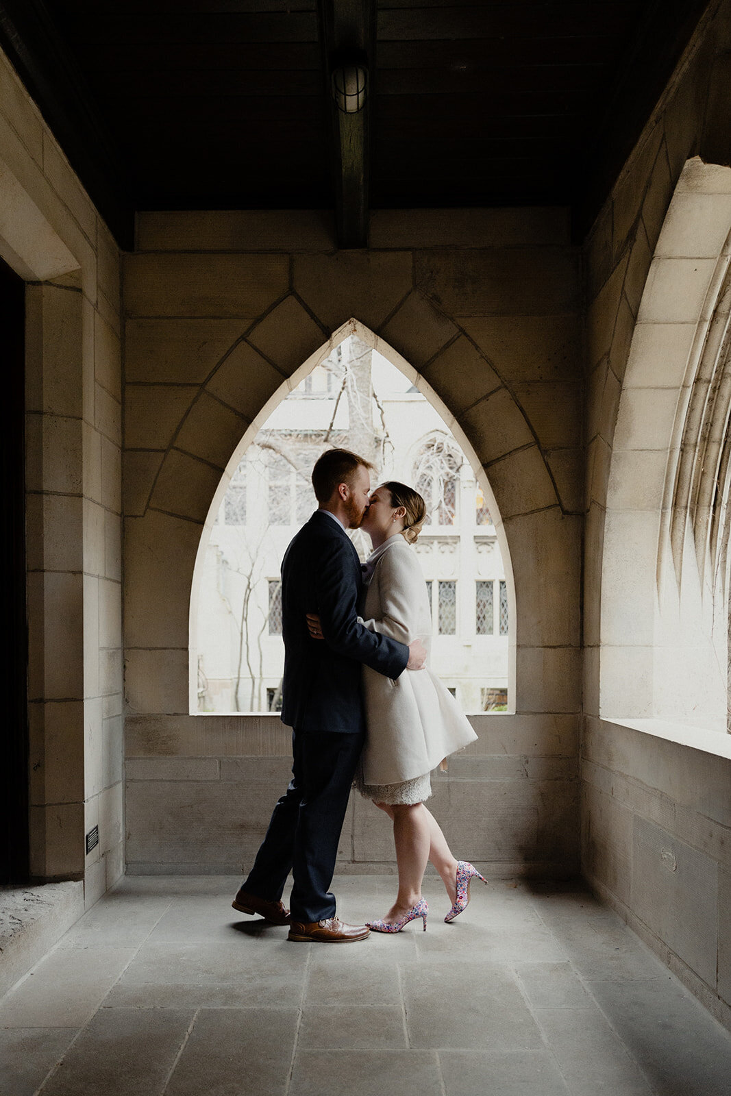 Just Married photo session couple in an old Chicago church couple embraces after reading their private vows to one another