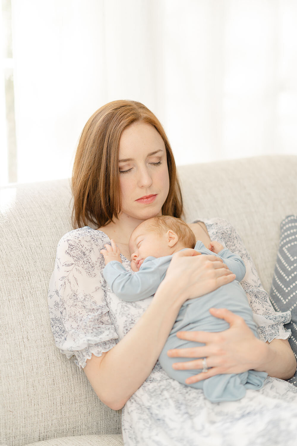 baby laying on mom's chest while she soaks it in, taken by TBP, a Northern VA newborn photographer