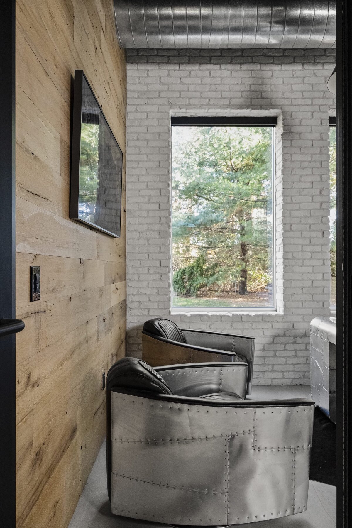 candra lynn interiors old bridge project wooden wall and white brick wall with windows