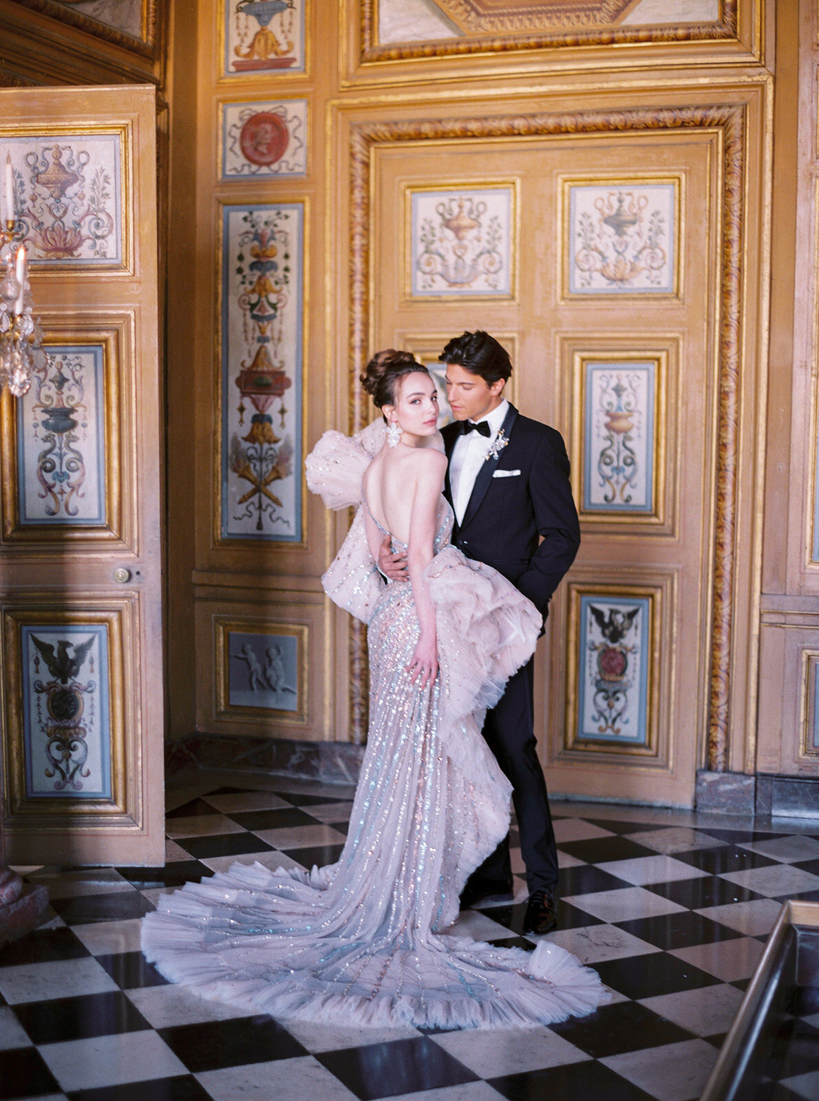 The photo was taken at Paris, France - Chateau Vaux le Vicomte, one of the top destination wedding venues in France, captured beautifully by photographer Audrey FORA. In addition to Audrey FORA's photography, East West Films also offers videography services at the venue.