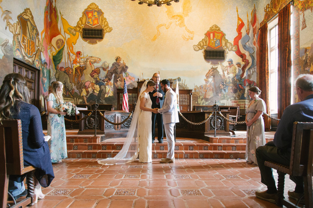 Bride and groom stand at altar at Santa Barbara Courthouse wedding
