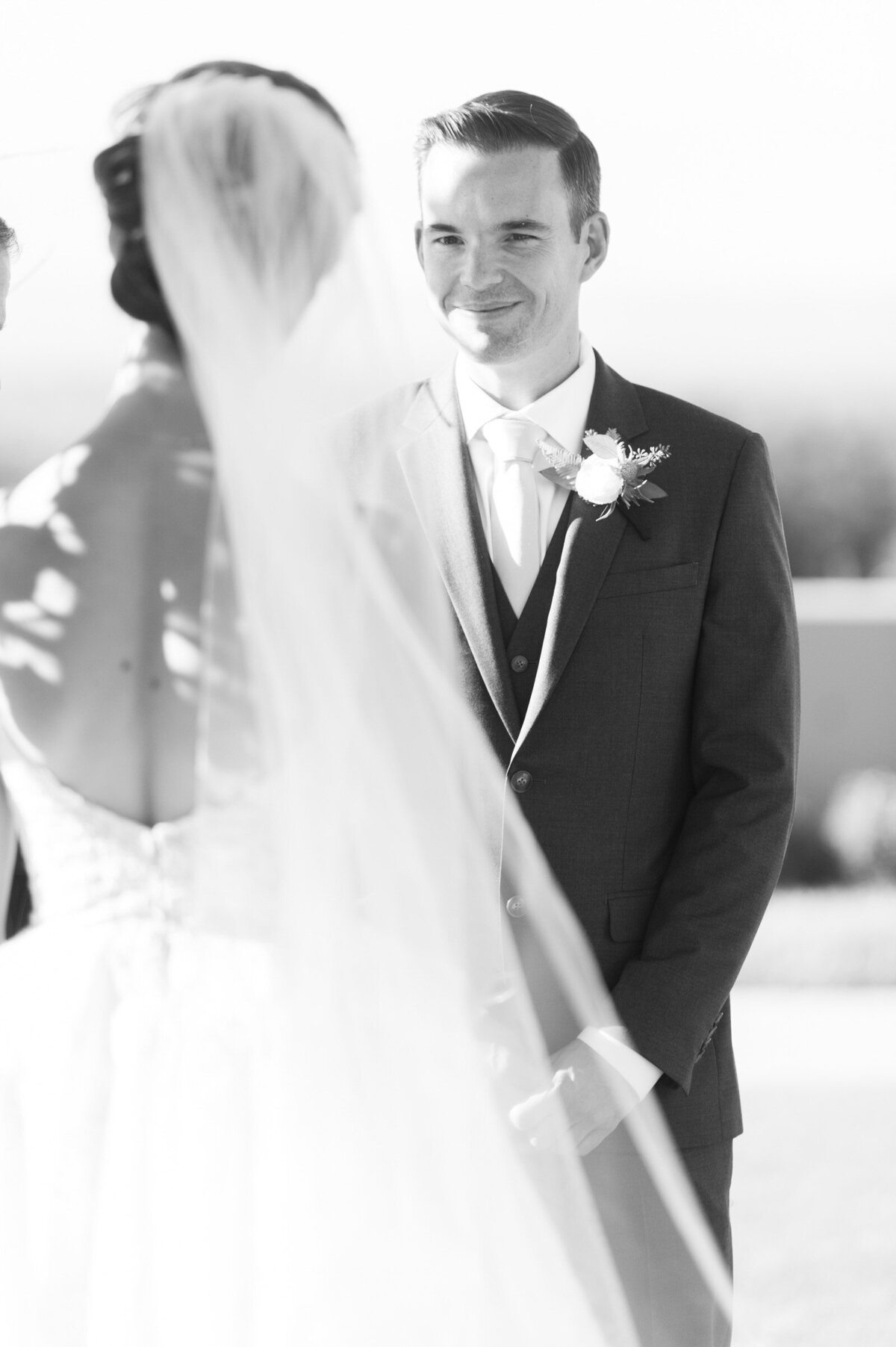 groom during the wedding ceremony looking at his bride at ponzi winery