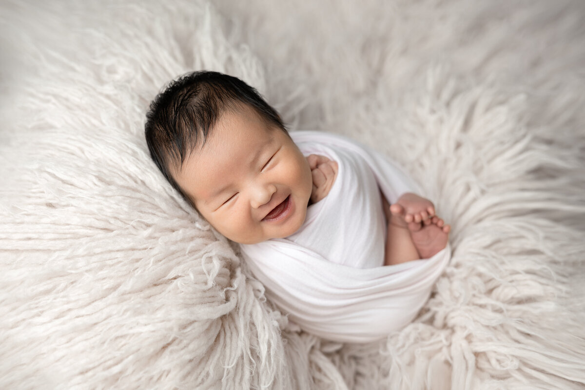 Newborn baby girl in pink flokati Edmonton studio photography 