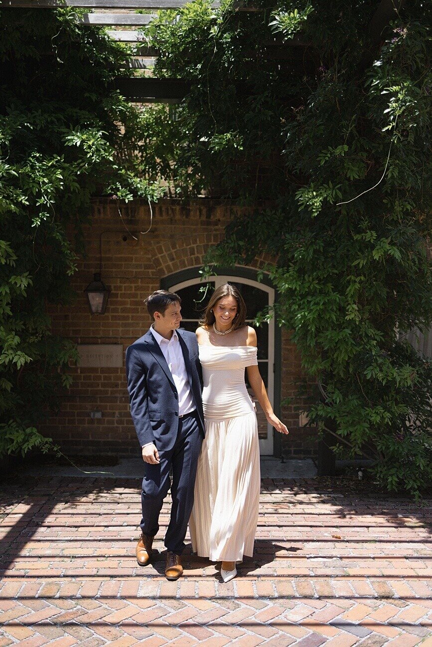 couple walking near greenery at Hotel Peter and paul