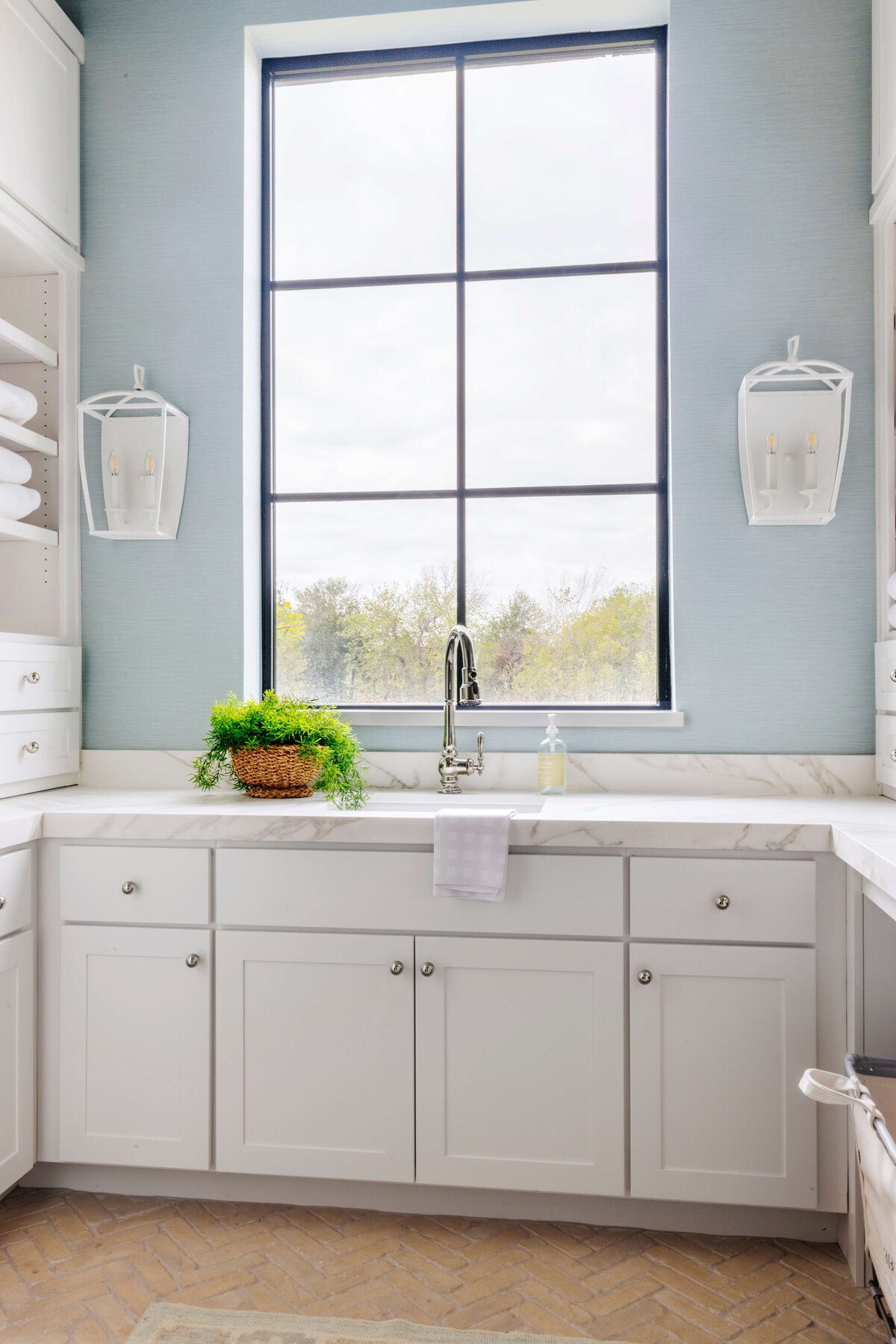 oyster creek studios hughes white vanity with marble counters in bathroom with storage