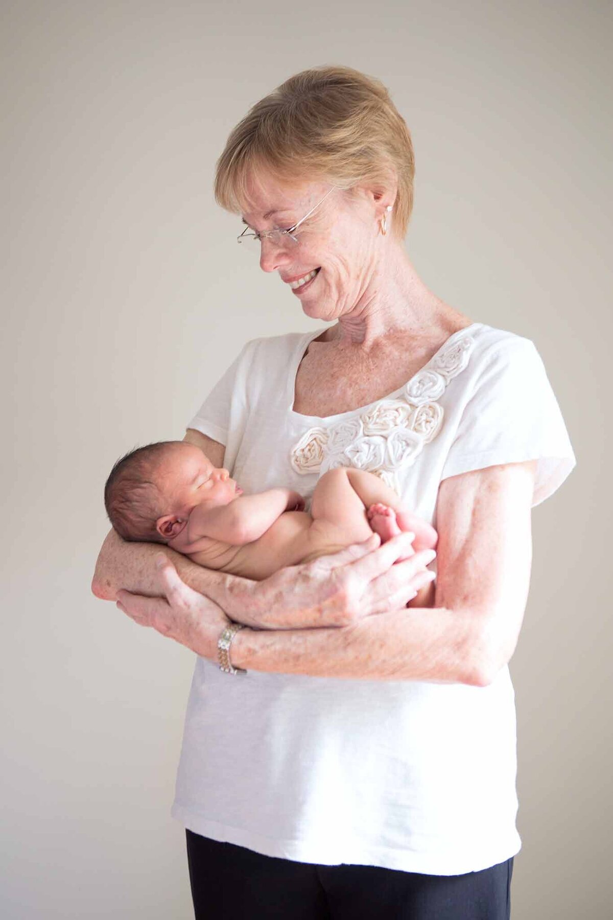 Grandmother holding newborn baby in Columbia SC