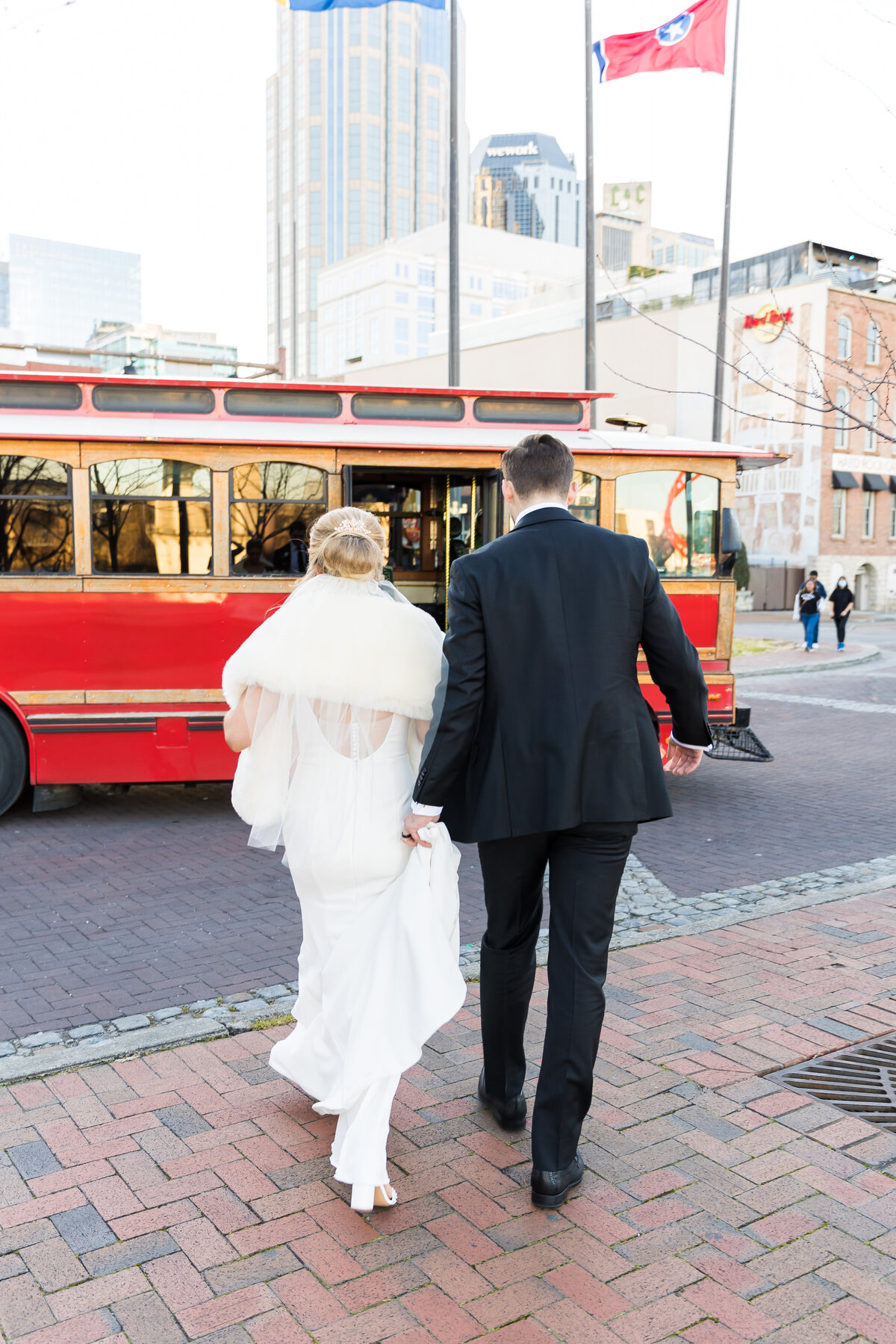 Bride and groom walking towards tram ar Nashville wedding
