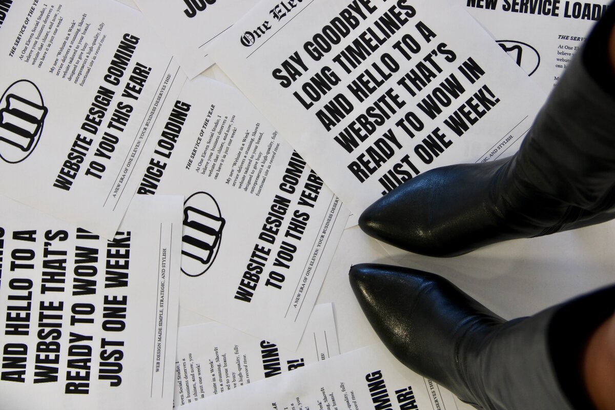 Knee-high boots stepping over newspaper announcing 'Website in a Week'—a fast, strategic web design service.