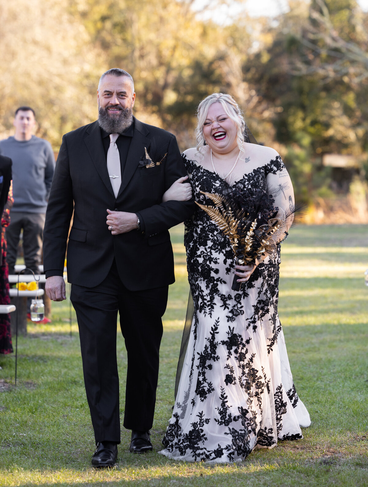 bride-walking-down-the-aisle-daughters-barn