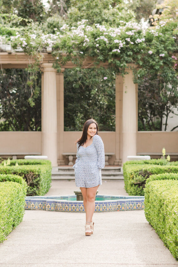 Senior girl walking in garden Balboa Park San Diego