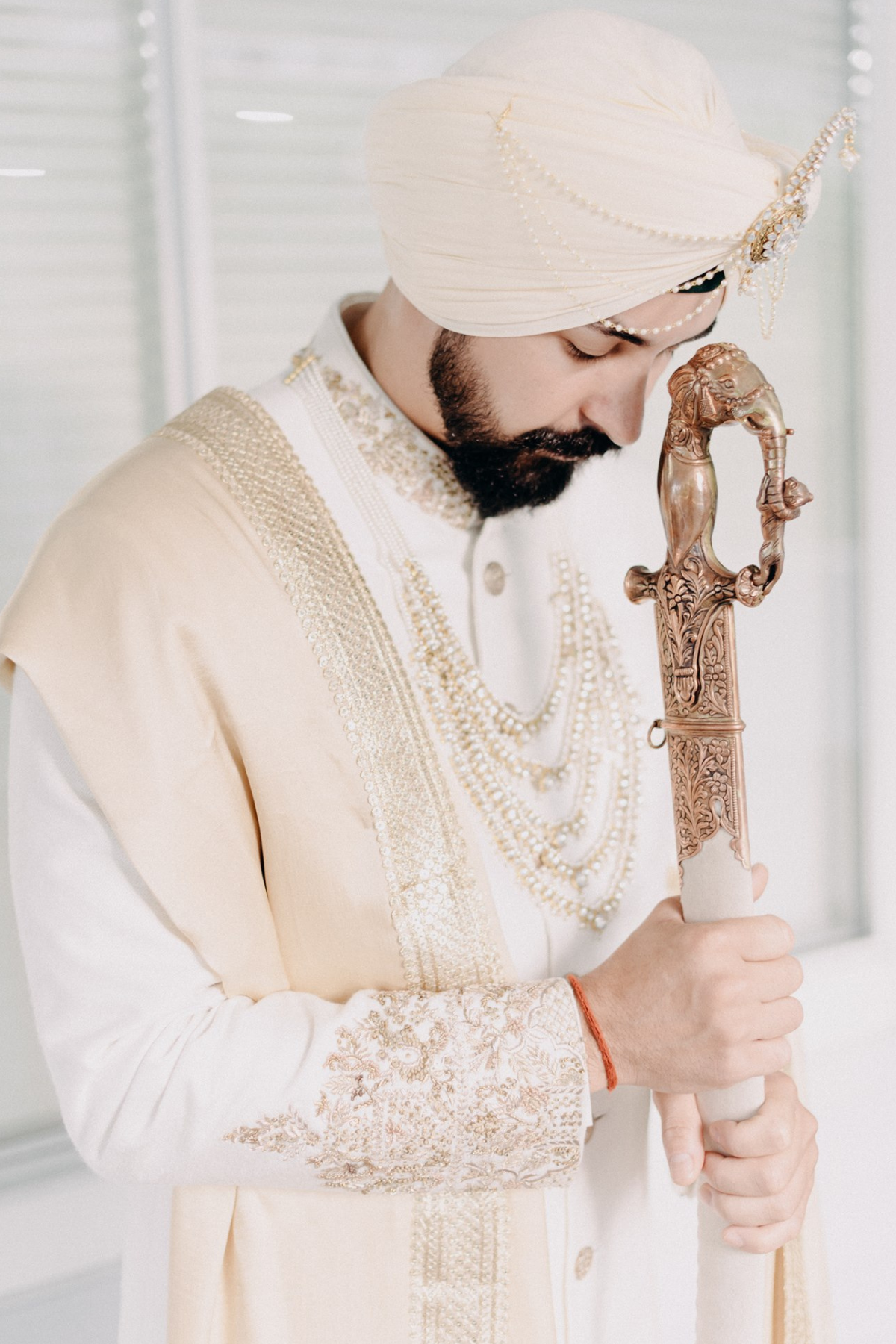 french-indian-sikh-groom-ivory-turban-sword-3