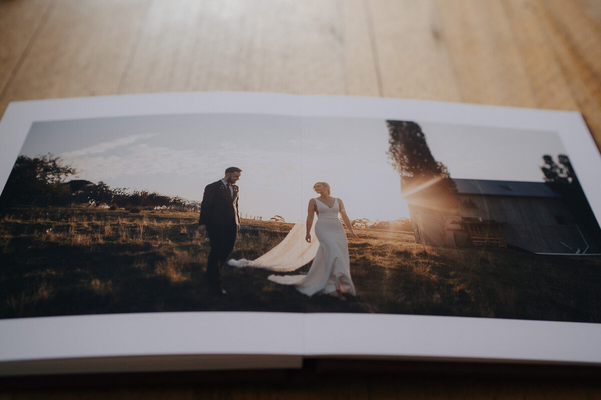 full spread page of couple at the farm yarra valley on fine art paper