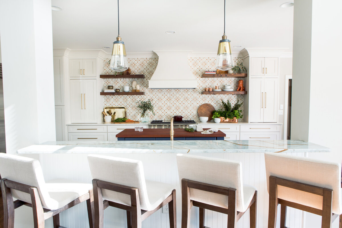 Open-concept kitchen and dining area in Lake Norman, NC, with pendant lighting and warm textures.