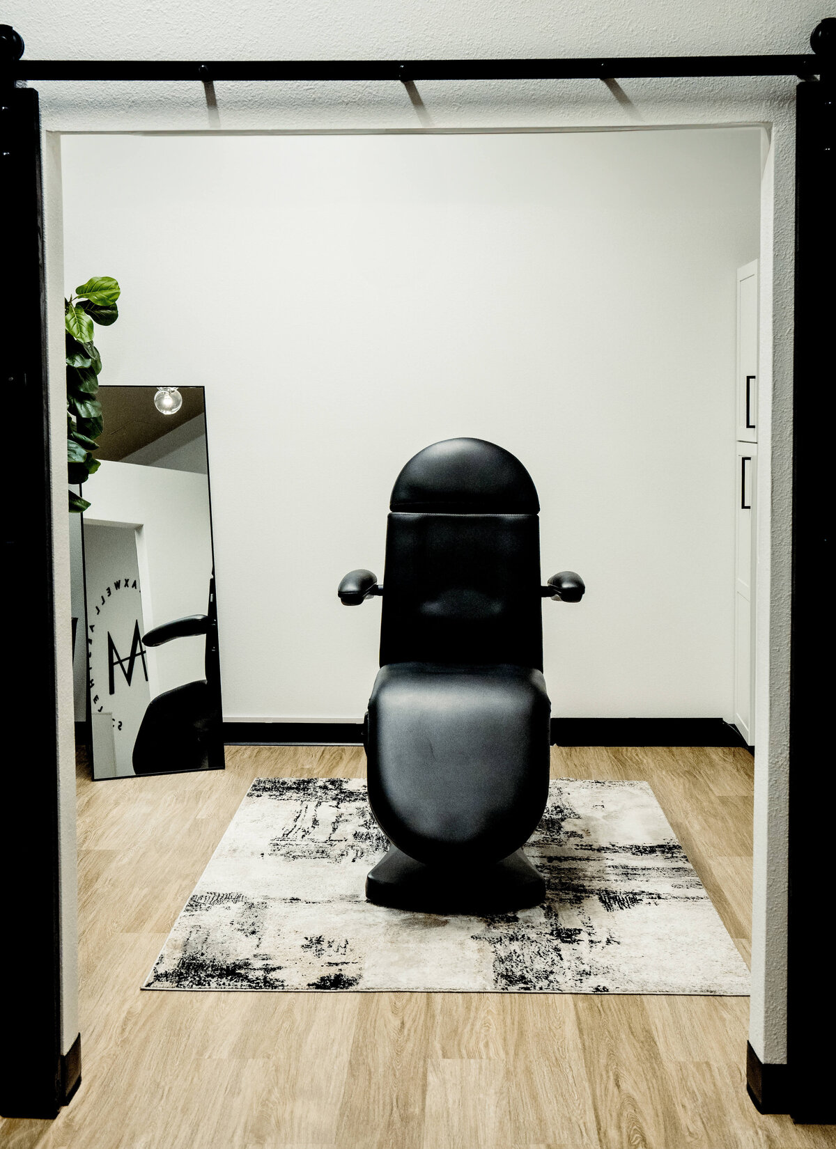 Maxwell Aesthetics treatment room featuring modern aesthetic chair and welcoming studio design in Salem, Oregon