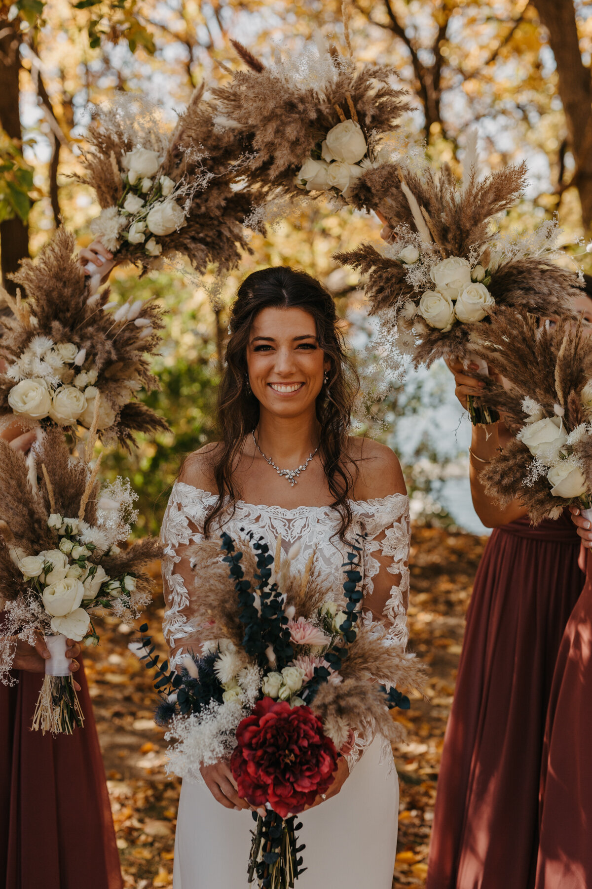 Bridal Portrait surrounded by bridesmaids bouquets