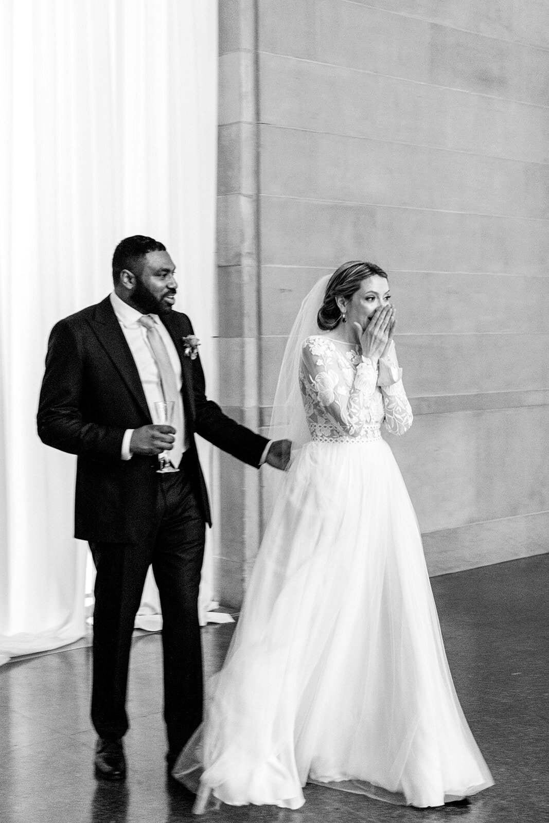 surprised bride at wedding reception room reveal