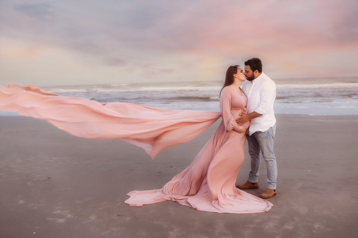 Expectant parents pose for Beach Maternity Photos in Charleston, SC.