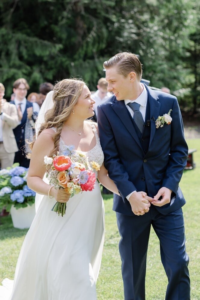 bride and groom share a smile after ceremony at Trinity Tree Farm