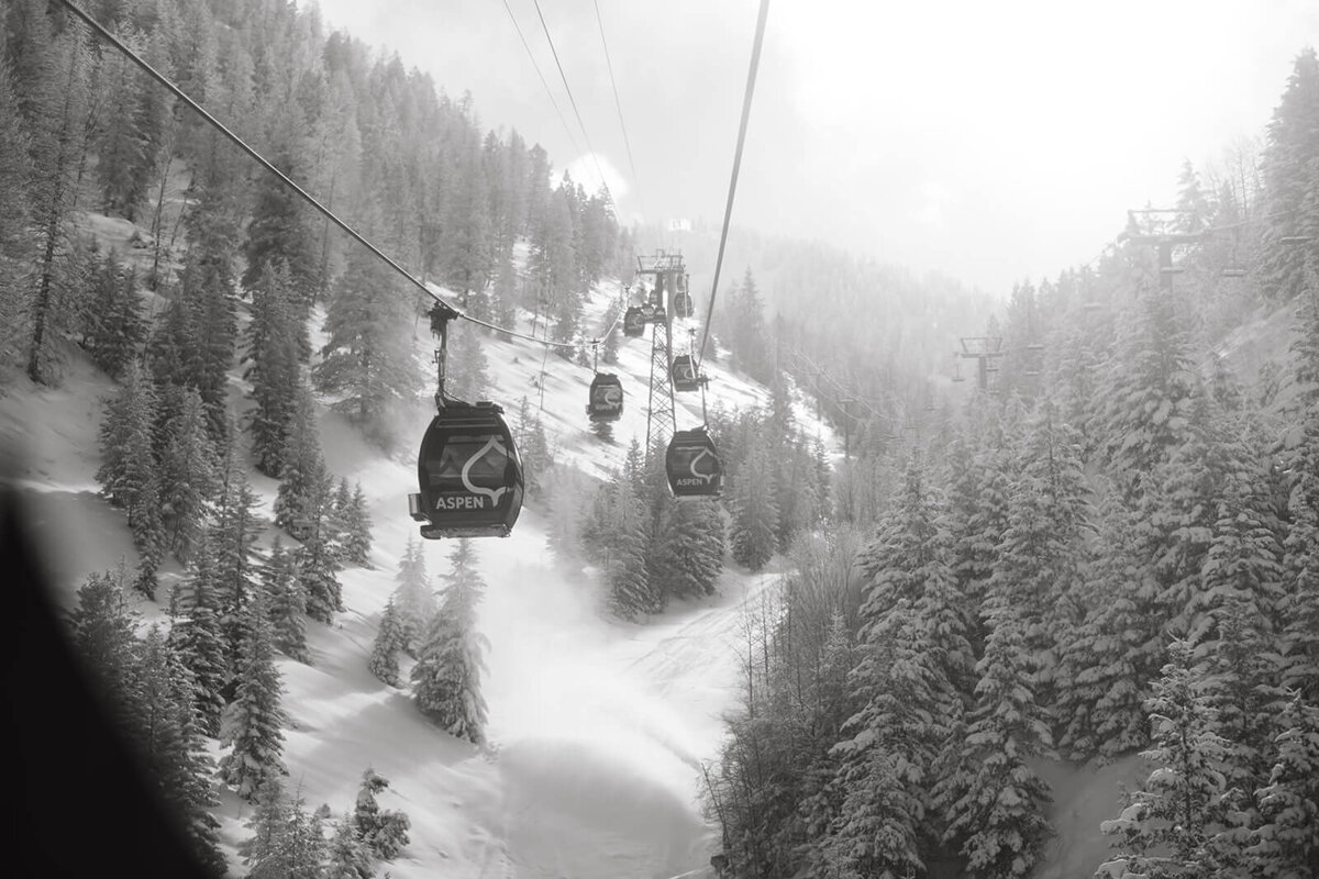 View of ski gondolas heading up mountain captured near the St. Regis Aspen wedding venue.