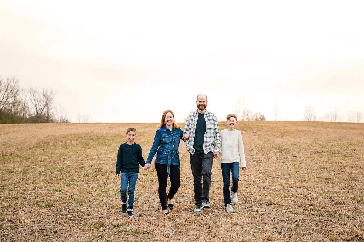 family walking in a field