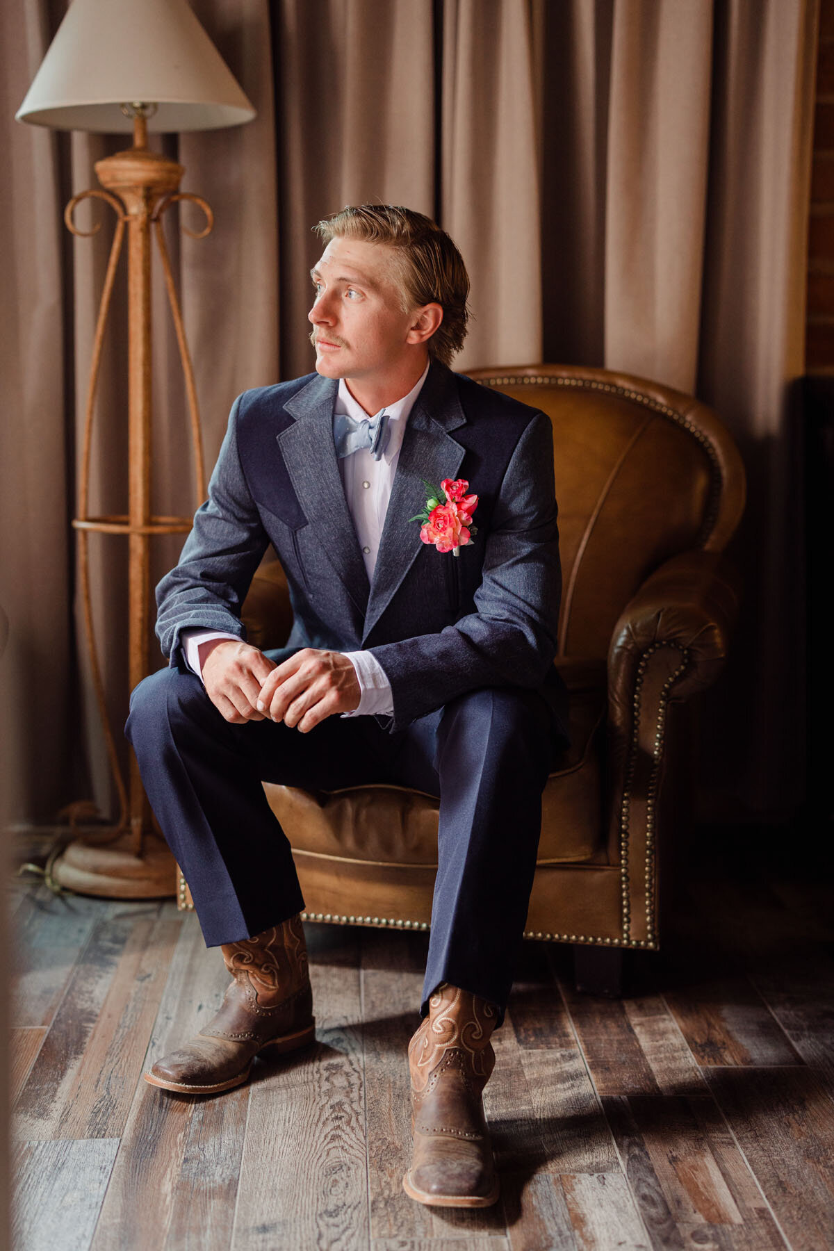 Groom sitting alone anticipating the ceremony.