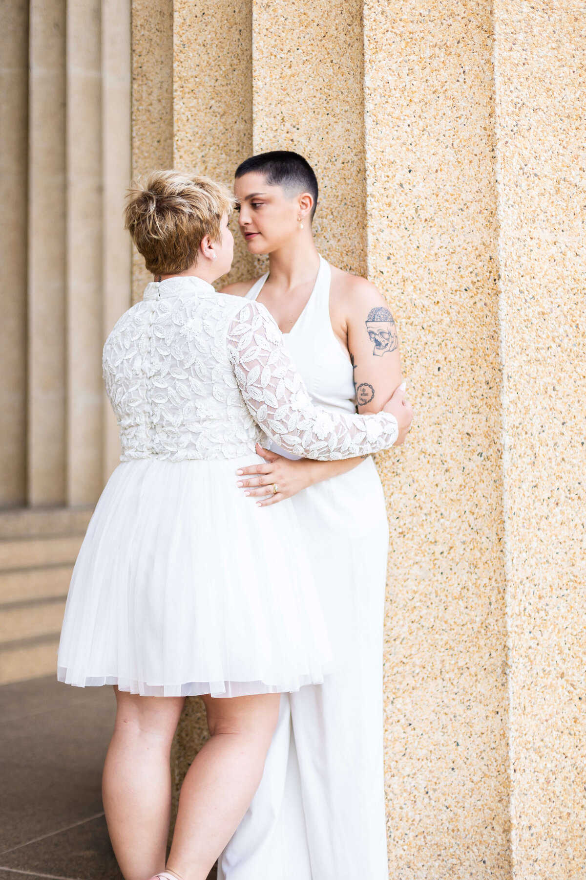 Gay woman wearing white outfits at LGTBQ wedding in Centennial Park, Nashville,TN