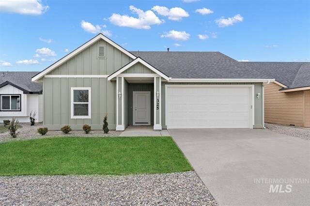 sage green house with white door