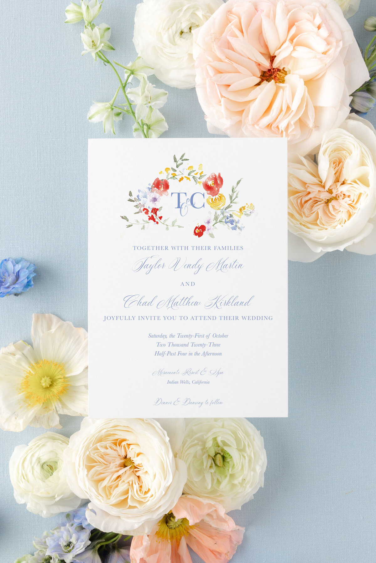 wedding invitation with watercolor floral monogram