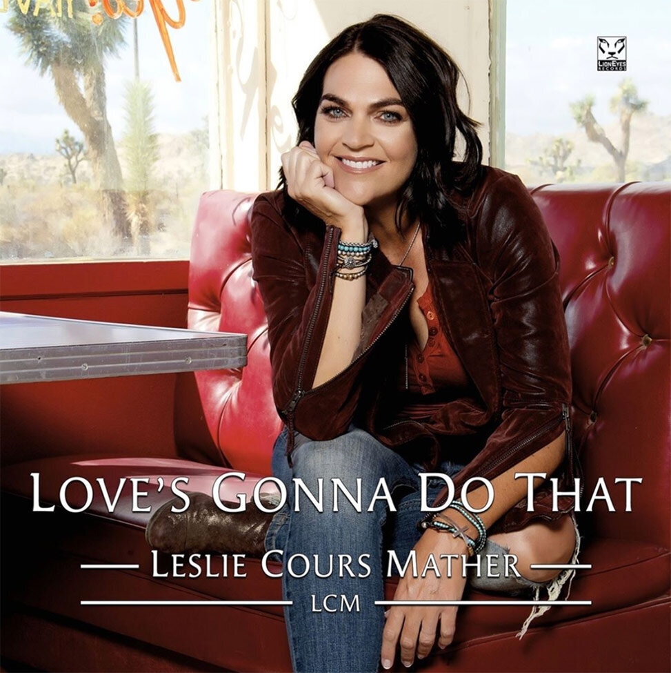 Single Cover title Loves Gonna Do That Artist Leslie Cours Mather sitting in red diner booth chin in hand