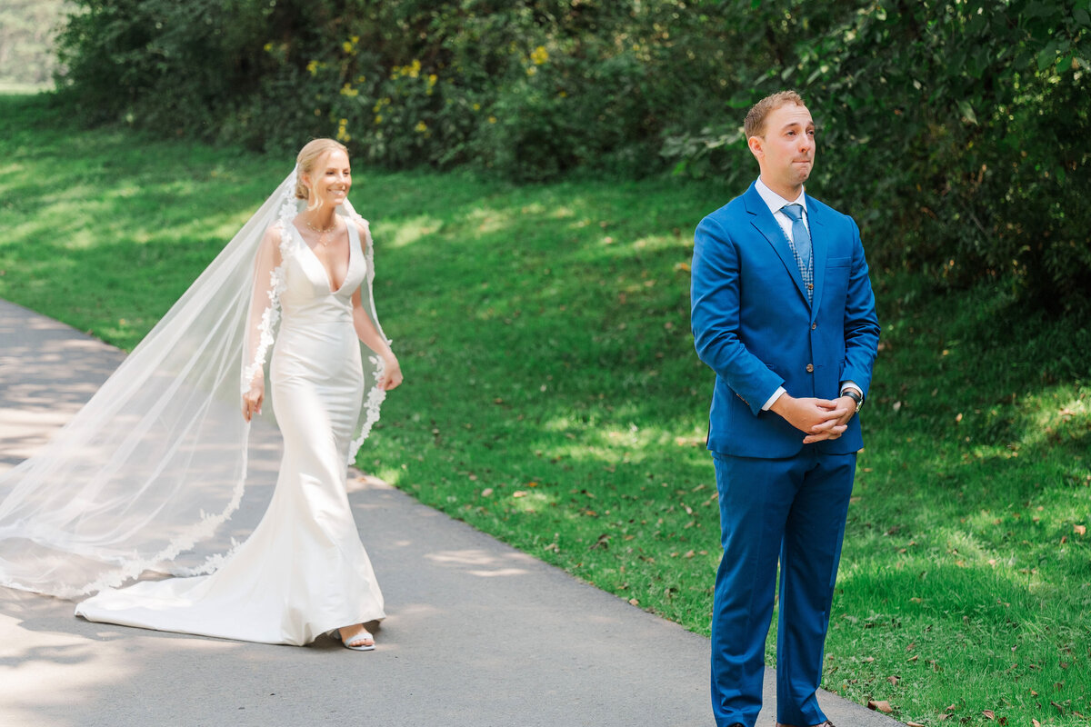 wedding couple seeing each other for the first time at their summer camp wedding