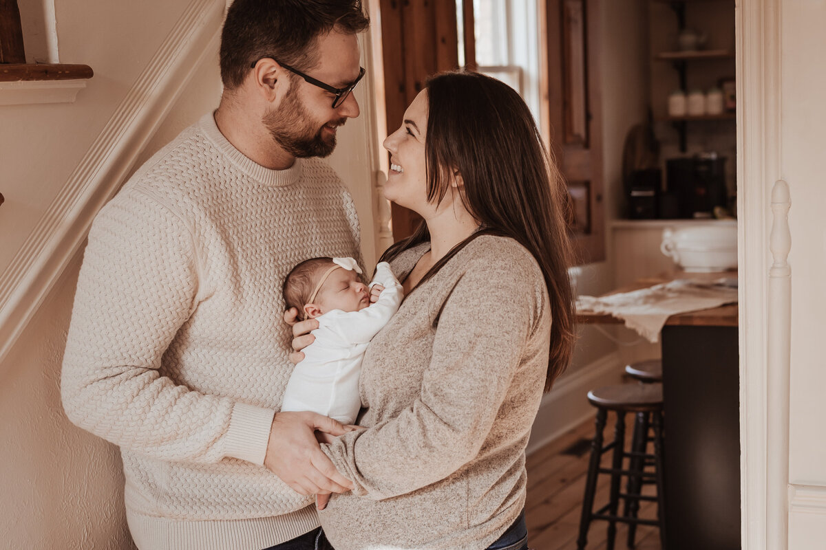 Mom and dad holding baby