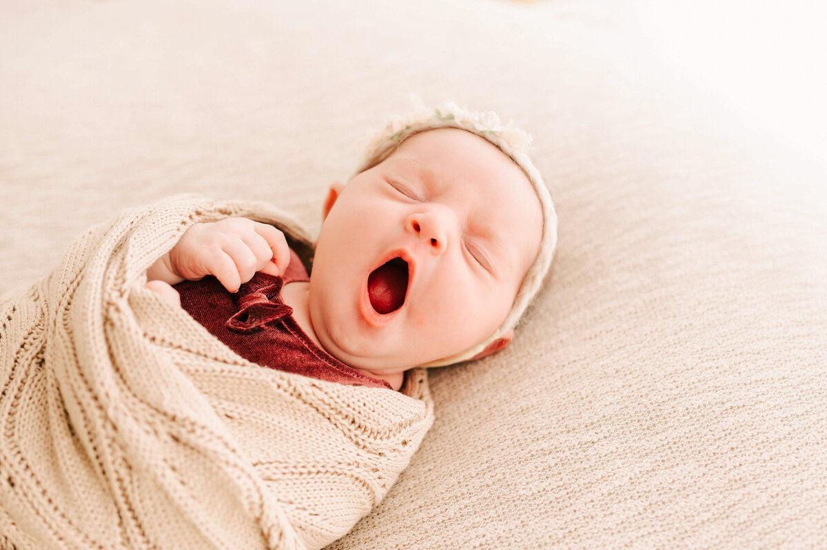 newborn baby girl yawning captured by Springfield MO newborn photographer
