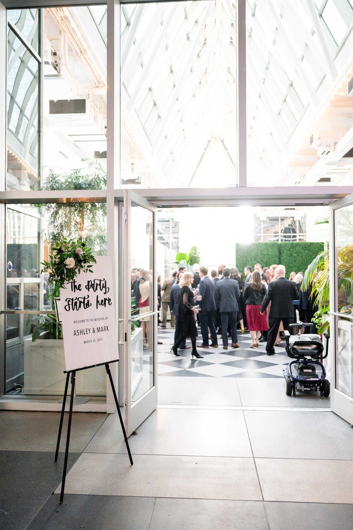 sign showing the entrance to the wedding reception space at wintergarden ppg place