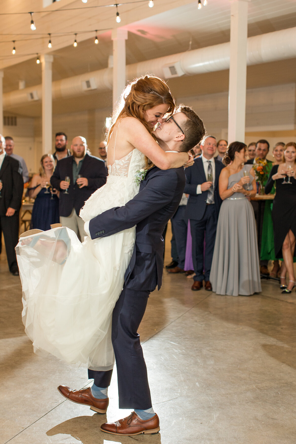 a couple kiss on the Dancefloor on their wedding day for a photograph in Banner elk, NC