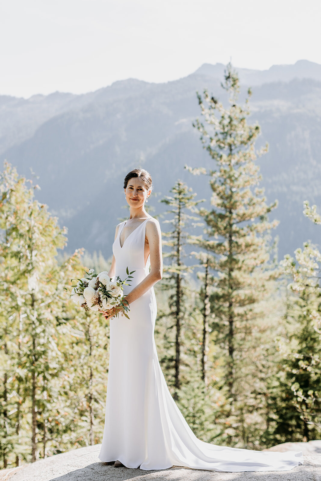Bride with custom flowers for Sea to Sky Gondola wedding Squamish - Within the Flowers