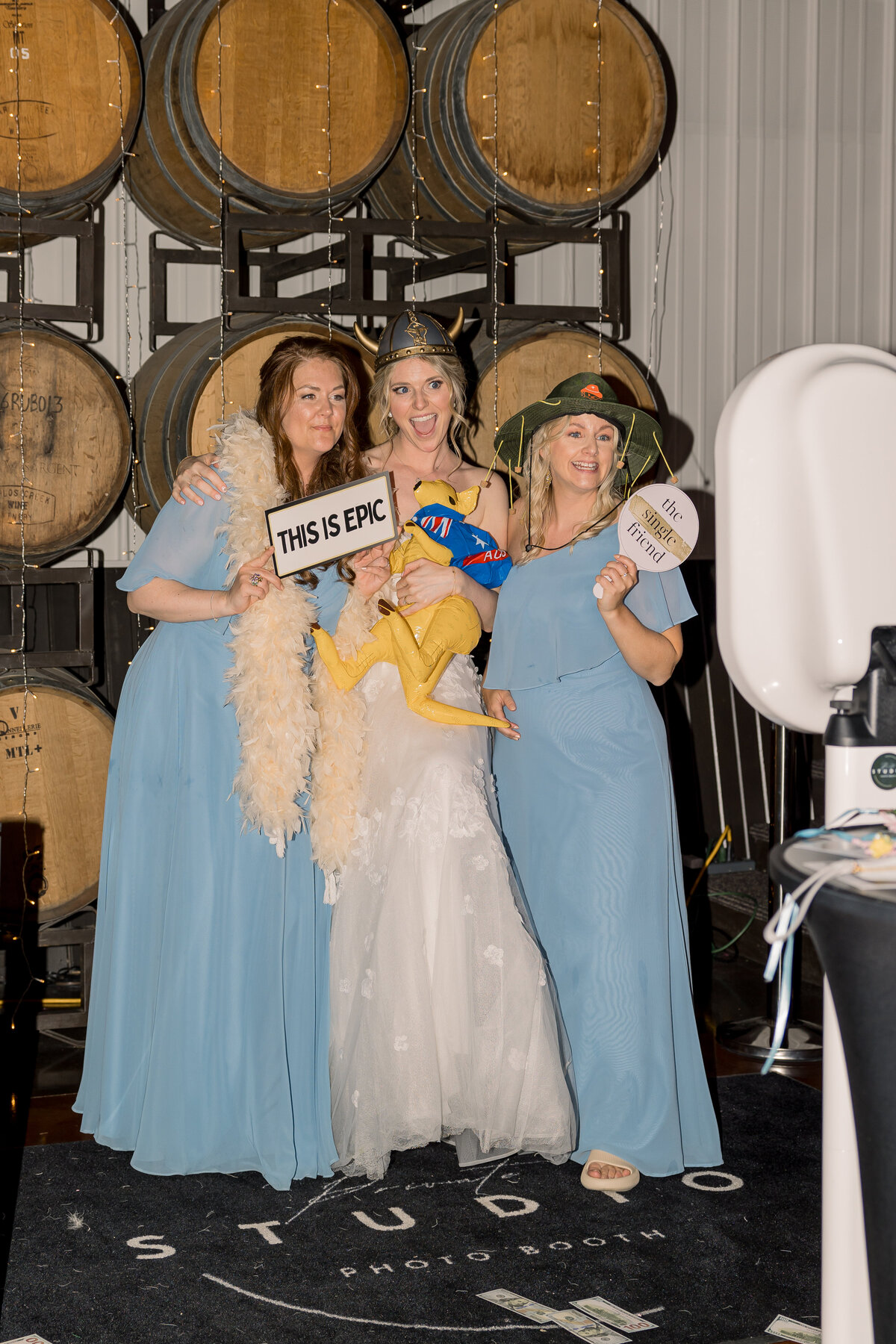 reception photo of bride and bridesmaids at photo booth at Carlos Creek Winery in Alexandria MN