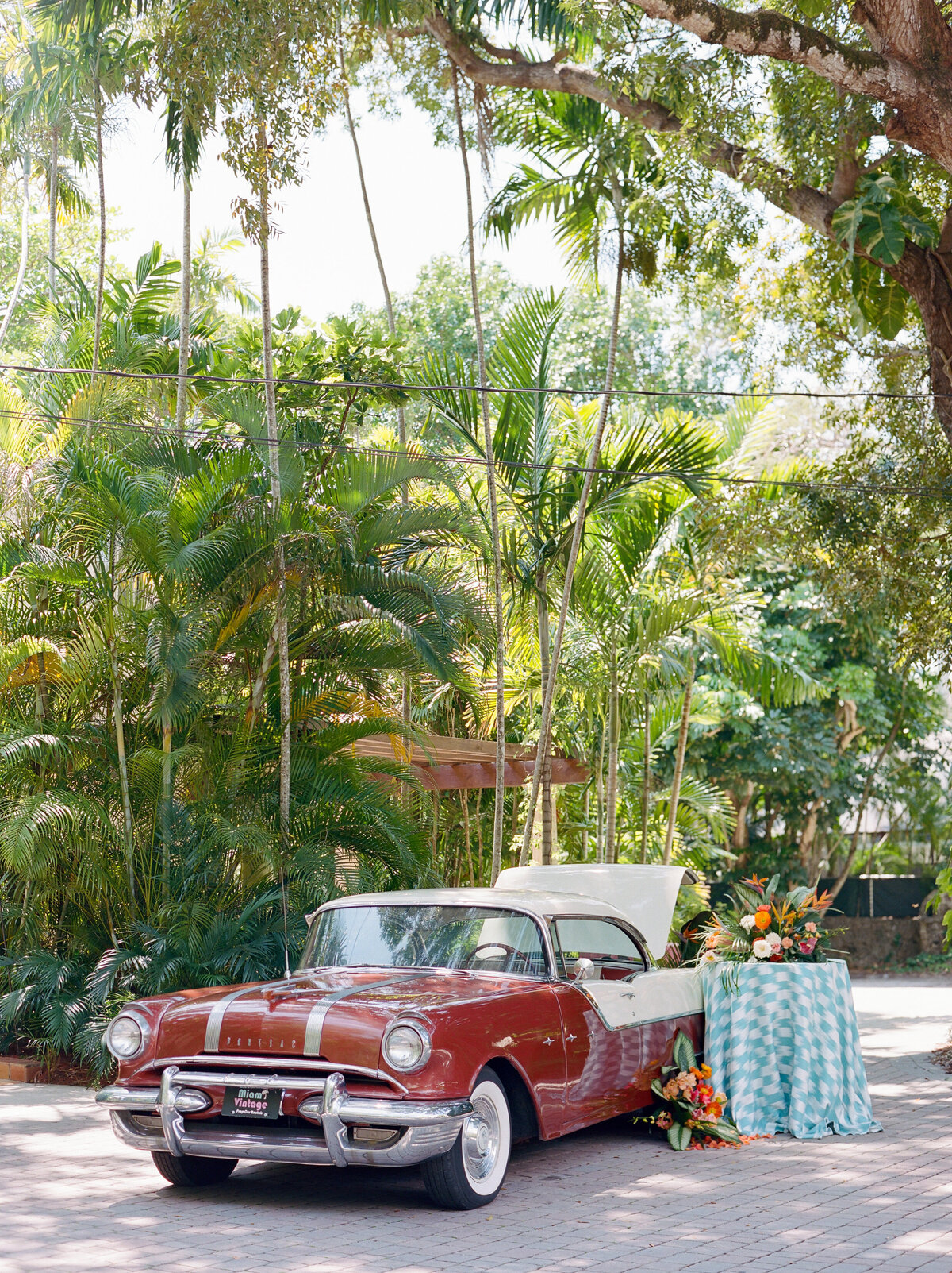 The awesome car and a little table next to it.