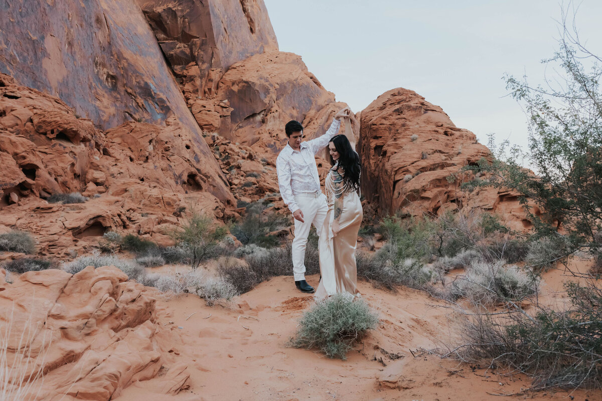 newlyweds dance on red rocks