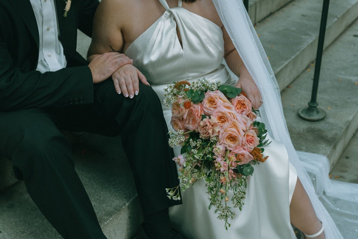 bride and groom on steps outside NYPL after eloping shot by Elsie Goodman Photography | NYC Elopement Packages
